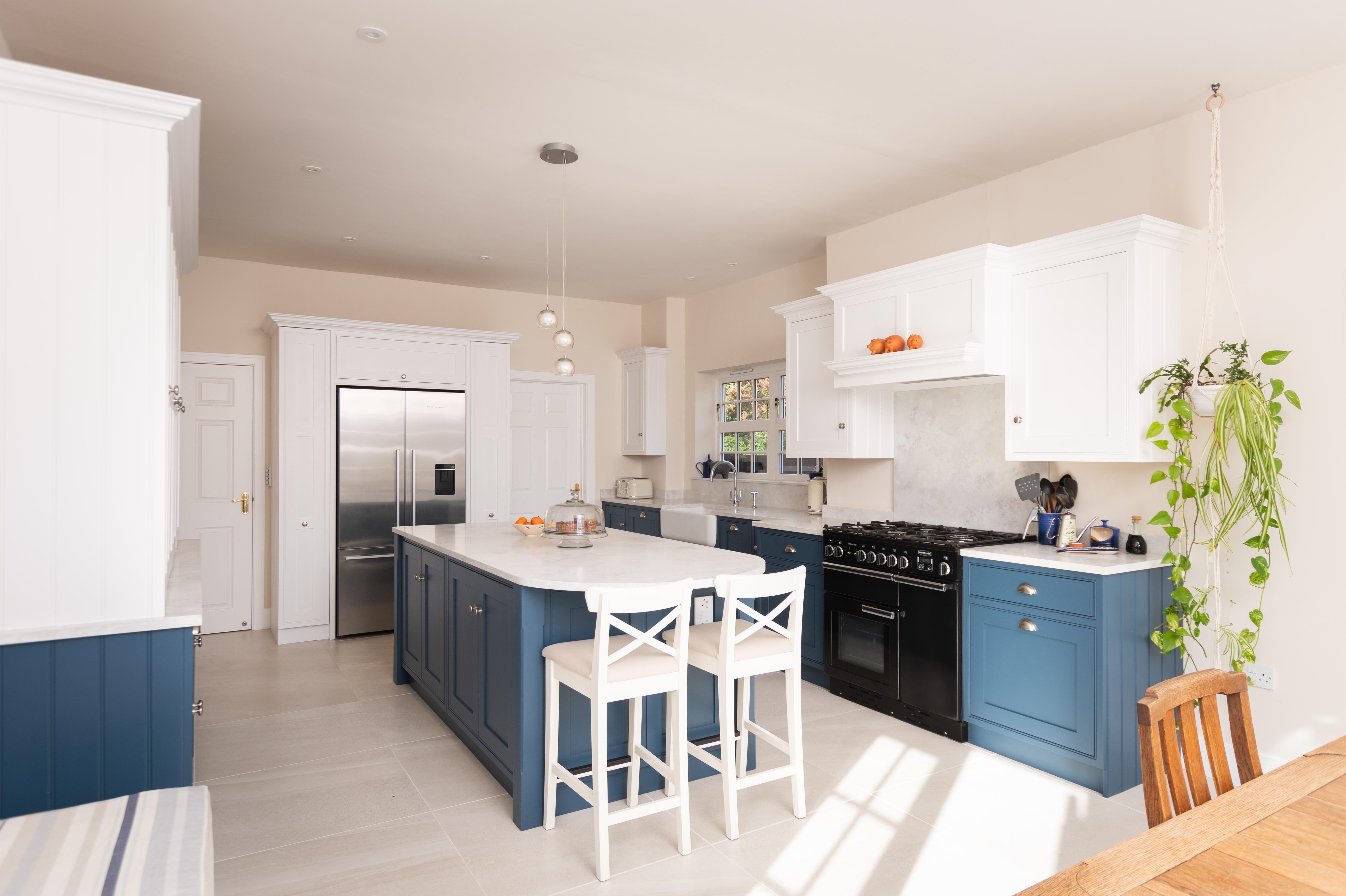 They wanted to make the kitchen more spacious and user friendly, so the wall dividing the kitchen and dining room was removed. This created a more open plan space to work with.